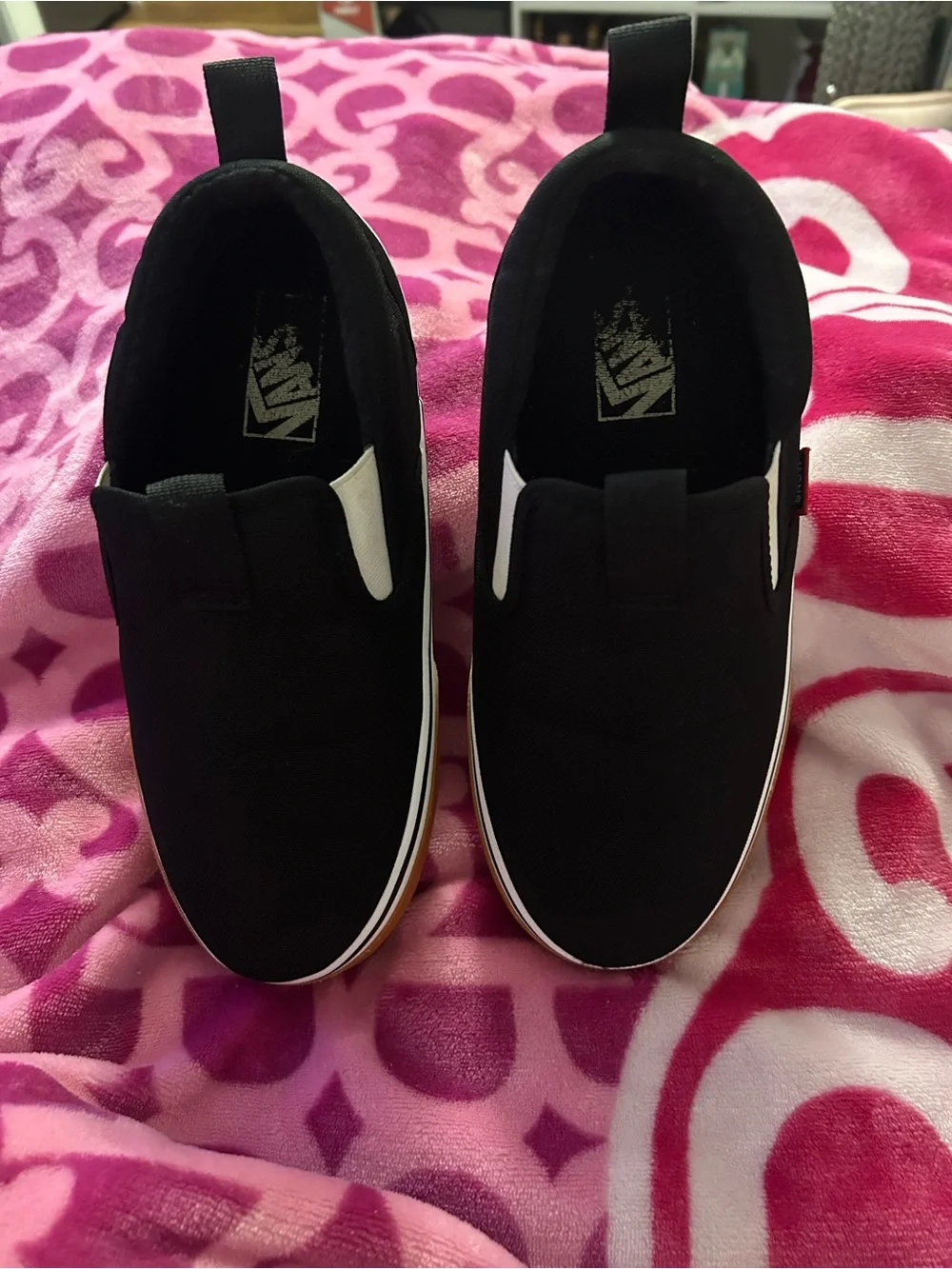 Vans Black Slip-On Sneakers with White Midsole and Gum Outsole